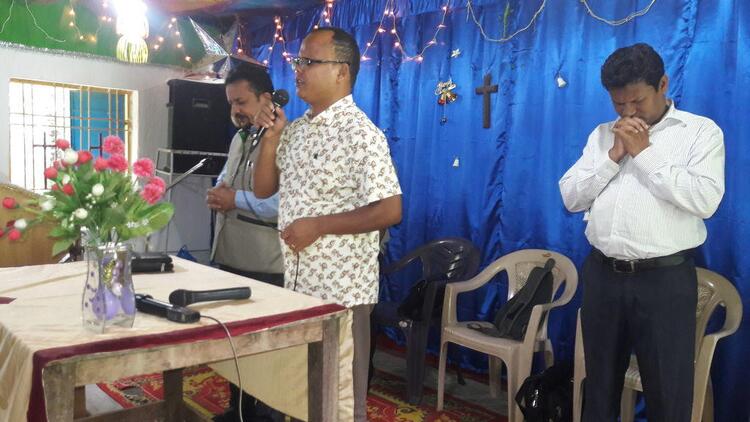 Rev J K Sangma sharing God's word in Orrisa